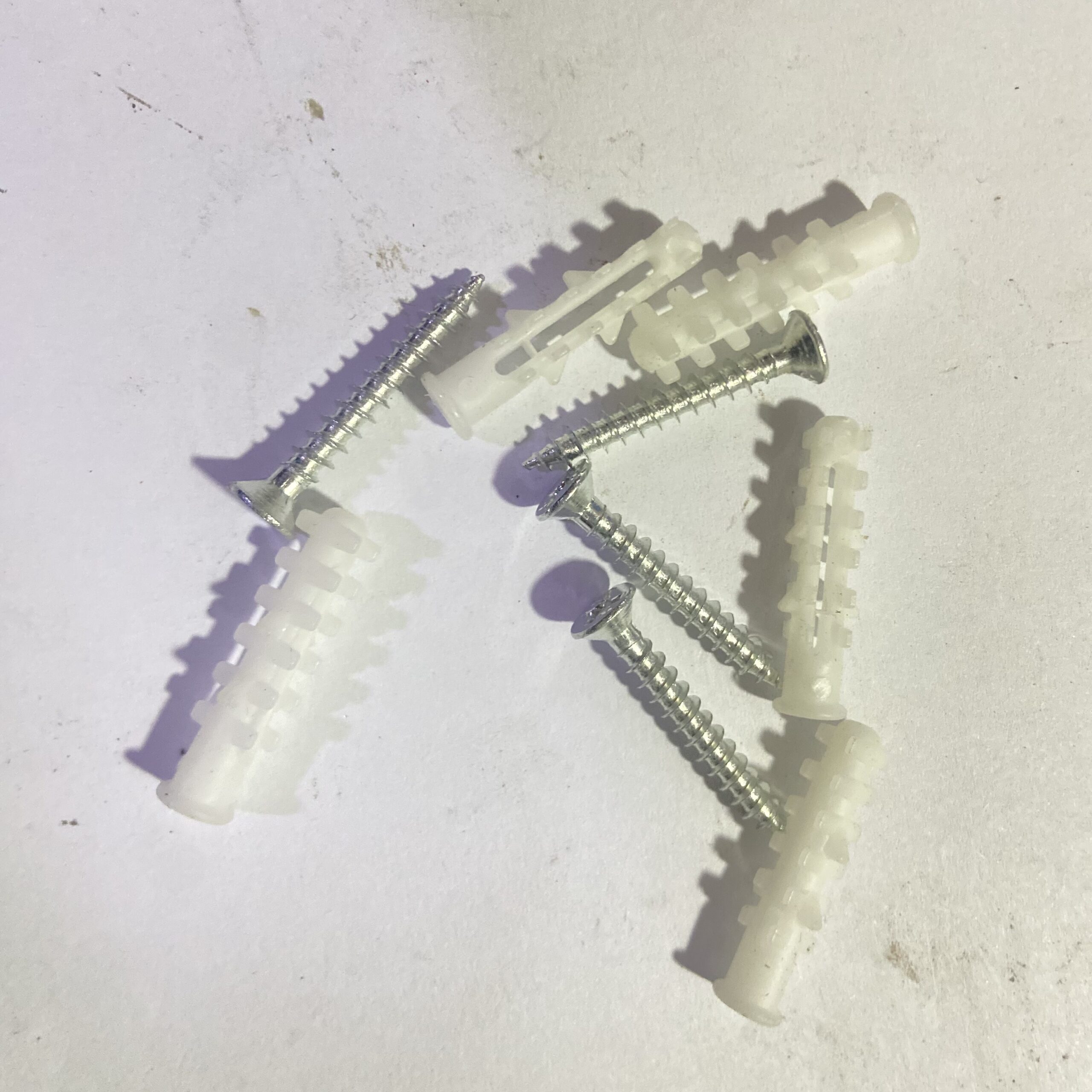Plastic wall anchor with screws